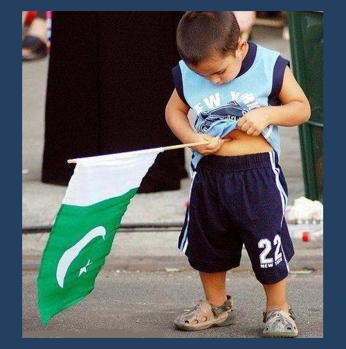 Pakistan's Flag Pictures - A kid tries to put flag stick in belly button - Images of Pakistani Flags