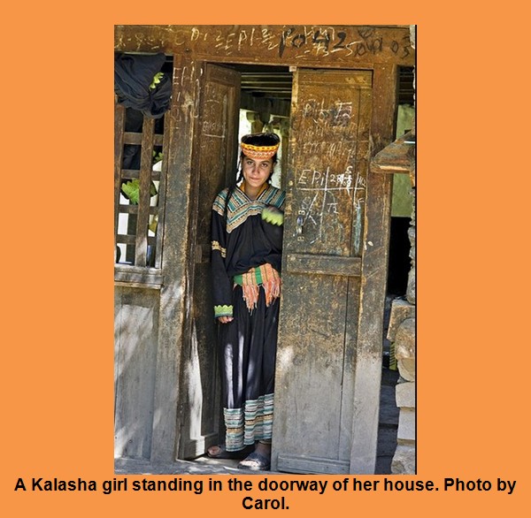 Kalash Photos, Images; A Kalasha girl in the doorway of her house - Kalash Valleys Pictures, Chitral Kalasha Pics, Images: A Kalasha girl in the doorway of her house - Pictures of Kalash Valleys of Chitral