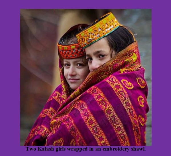 Kalash Photos, Images; Two Kalash girls wrapped in an embroidery shawl - Kalash Valleys Pictures, Chitral Kalasha Pics, Images: Two Kalash girls wrapped in an embroided shawl - Kalash Valleys of Chitral Photos