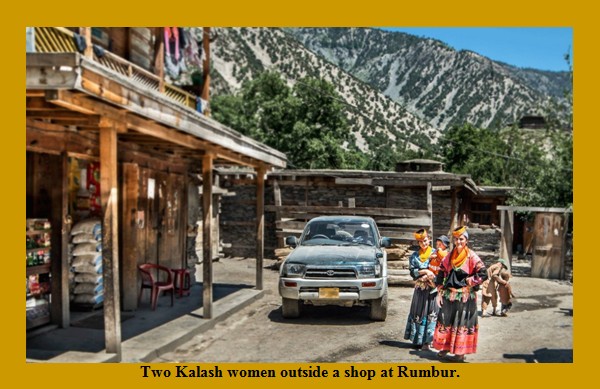 Kalash Photos; Two Kalash women standing near a shop - Images of Kalash Valleys, Chitral Kalasha Pictures: Two Kalash women standing near a shop at Rumbur - Photos of Kalash Valleys , Pics Kalash Valleys of Chitral