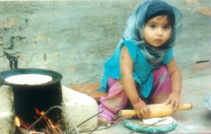 Another little cook, a chappati expert.