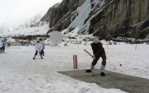 Siachin Pictures: Soldiers playing cricket in Siachin on snow, a dish antenna and a bunker are visible - Photos, Images of Siachin