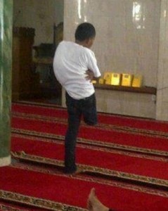 Namaz (Salat) Pictures - A boy with only one leg is offering Namaz in standing position in a mosque. Do we have any excuse to skip Namaz? - Namaz Photos