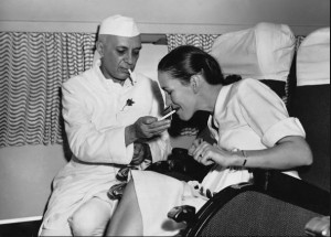 Jawaharlal Nehru Lighting Cigarette of a British Woman on a BOAC Plane: Write a Creative Caption to Practice Caption-Writing for Contests