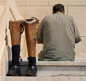 Namaz (Salat) Pictures - A man with two artificial legs is performing wuzu (ablution) in a mosque before Namaz. Do we have any excuse to skip Namaz? - Namaz Photos