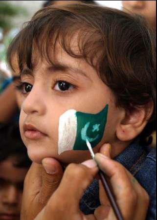 Pakistan Flag Lovers - Pakistani flag is being painted on a little girl's cheek - Display of Pakistani fla Proud Display of Pakistani Flag - Pakistani flag is being painted on a little girl's cheek - Pakistan Flag Lovers