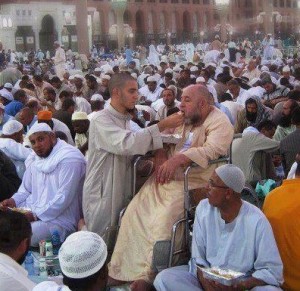 Best Father Quotes: Islamic quotes about Father - A son feeding his father during Iftaar in Mecca (Makkah) - Father's importance in Islam - Famous Father Quotes