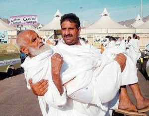 Best Father Quotes: Islamic quotes about Father - A man is carrying his old father during Hajj - Father's importance in Islam - Famous Father Quotes